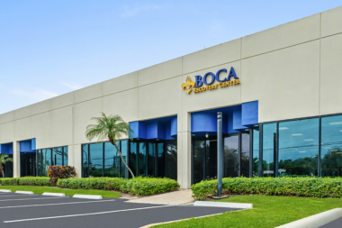 Angled exterior view of the Boca Recovery Center facility entrance and signage.