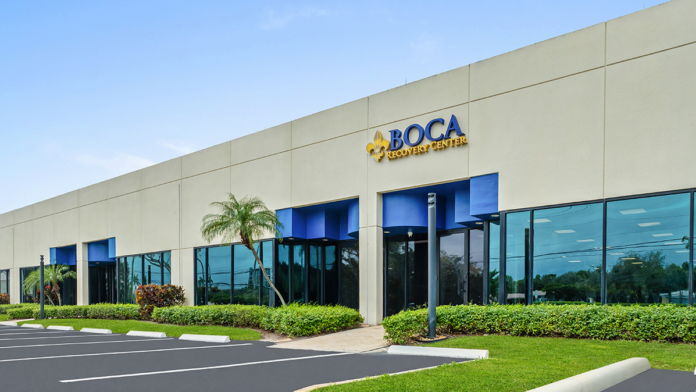 Angled exterior view of the Boca Recovery Center facility entrance and signage.