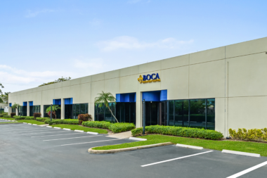 Exterior side view of the Boca Recovery Center facility and front windows.