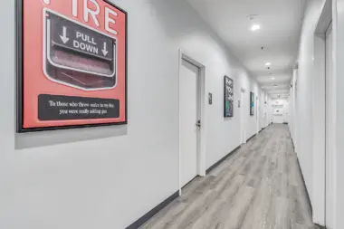 Inspirational artwork on the walls of Boca Recovery Center Huntington, featuring motivational quotes and colorful designs in a hallway.