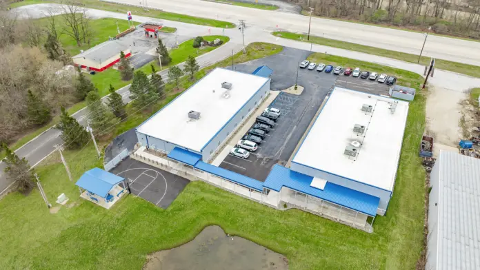 Aerial view of the back of Boca Recovery Center Huntington, showcasing parking and the surrounding area.