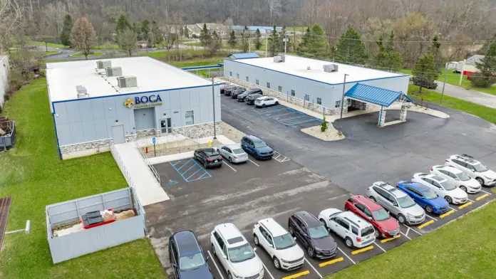 Bird's-eye view of Boca Recovery Center Huntington, showcasing the parking area and main entrance.