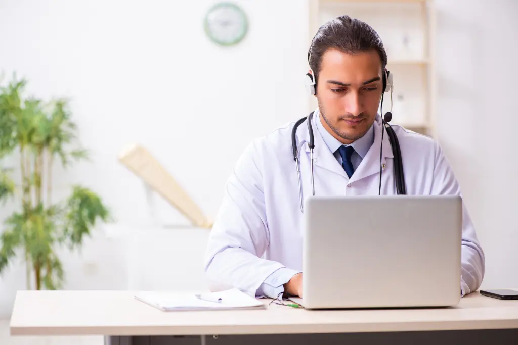 A doctor holds a telehealth session with a patient