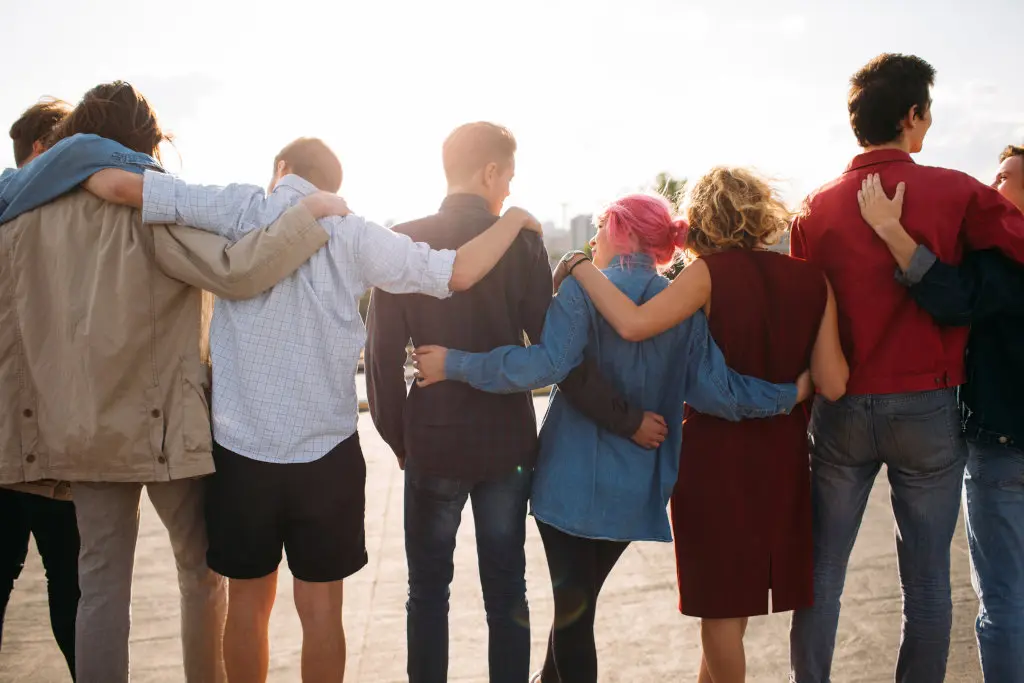 People lean on each other, showing shared comradery