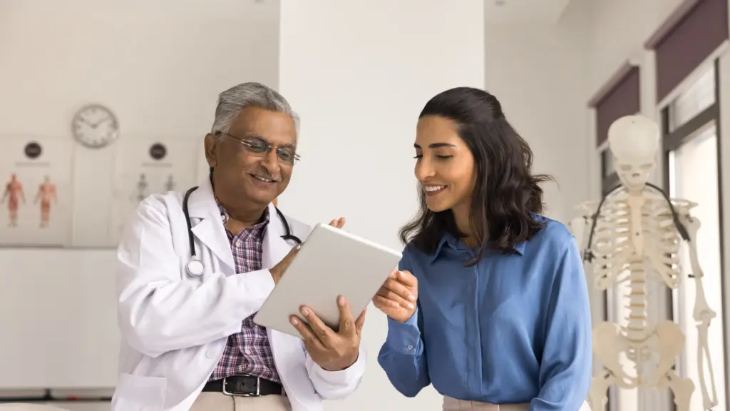 A doctor explains medication assisted treatment to a patient