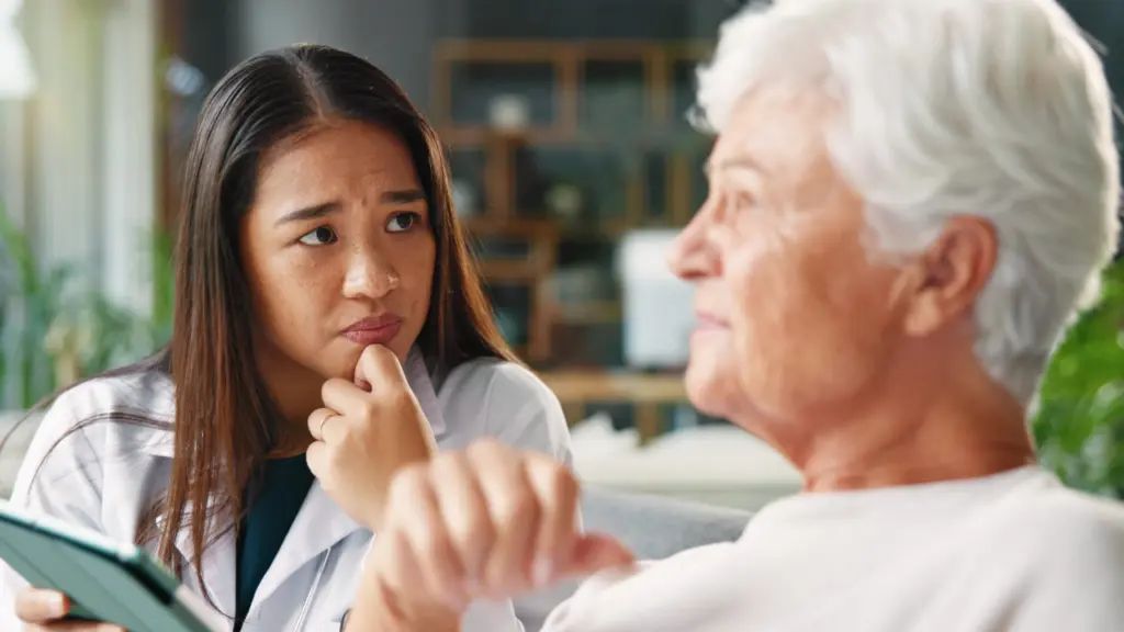 A doctor speaking with a patient during an assessment
