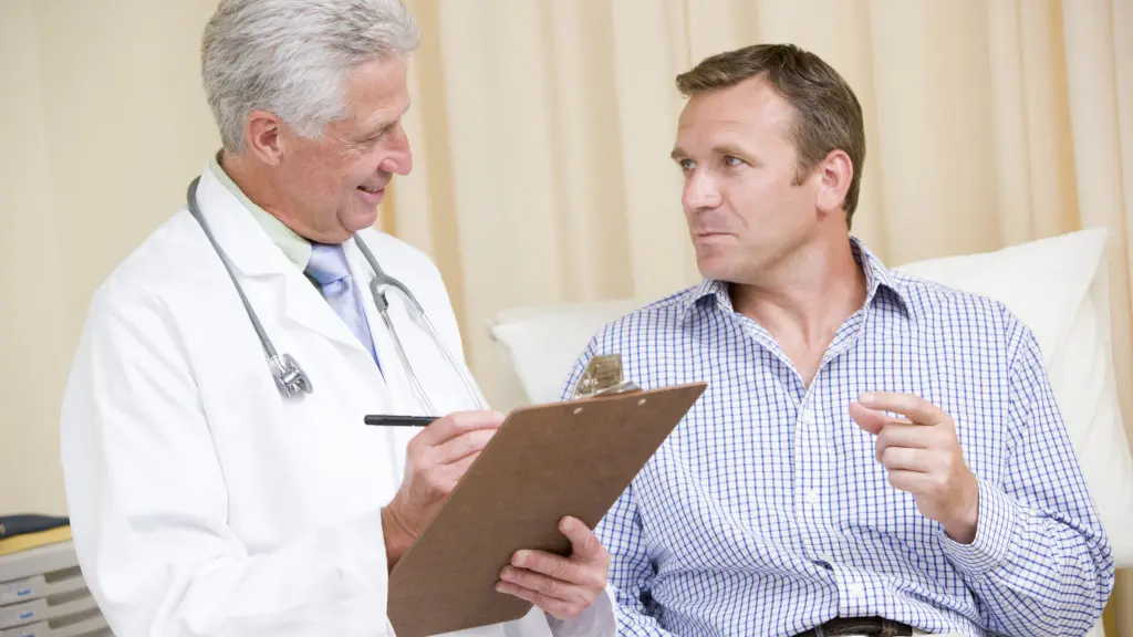 A doctor speaks with a patient during a withdrawal assessment