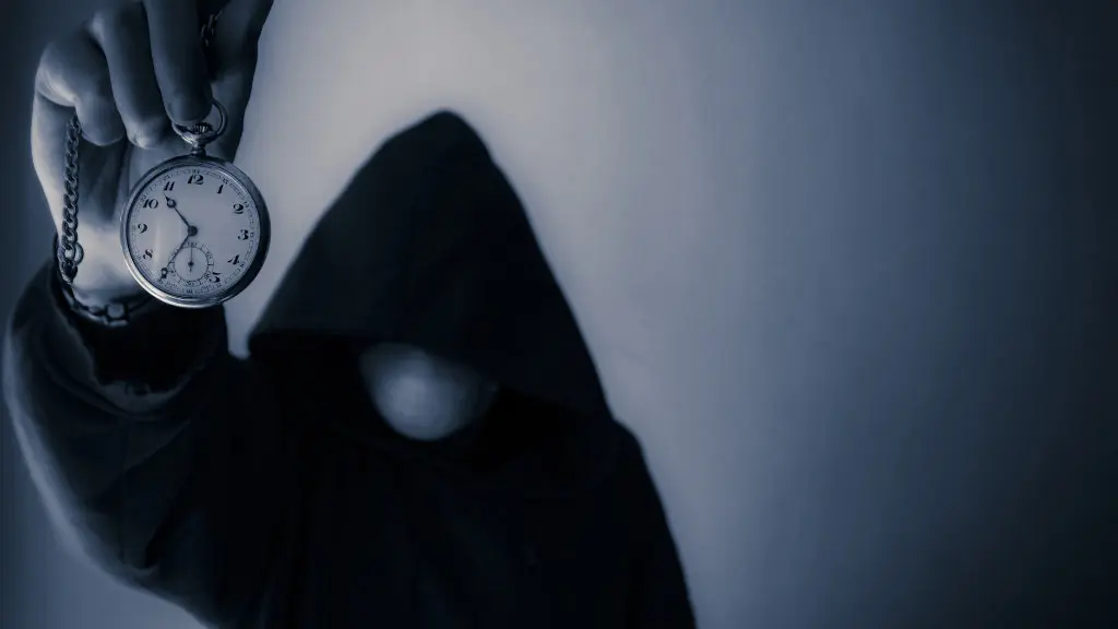 A mysterious man in a hoodie holds up a stopwatch