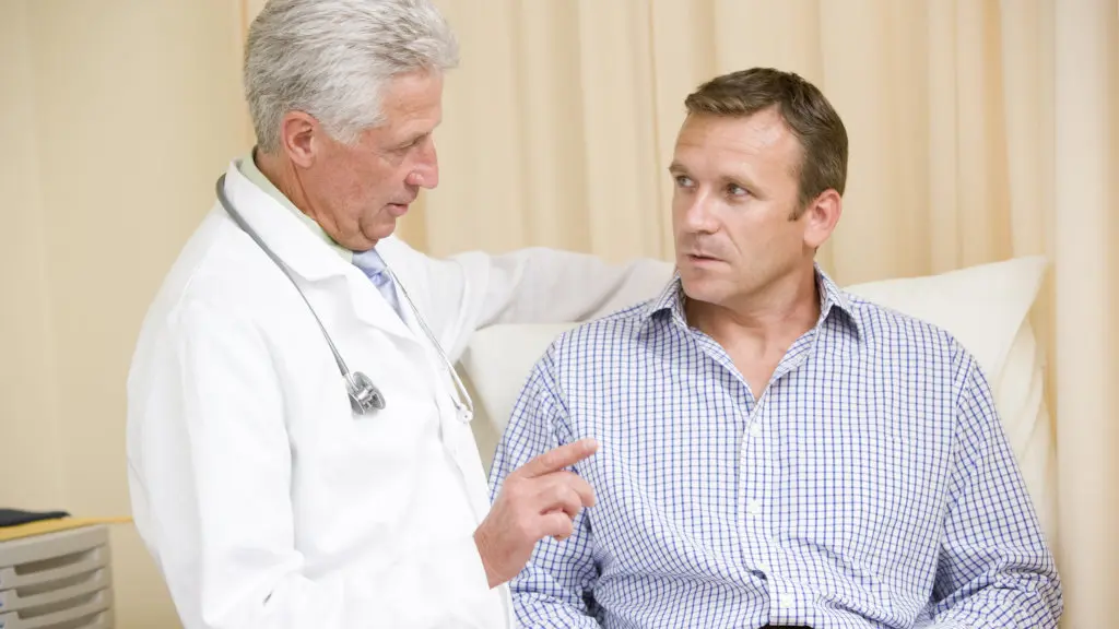 A doctor speaking with a patient during an alcohol withdrawal assessment