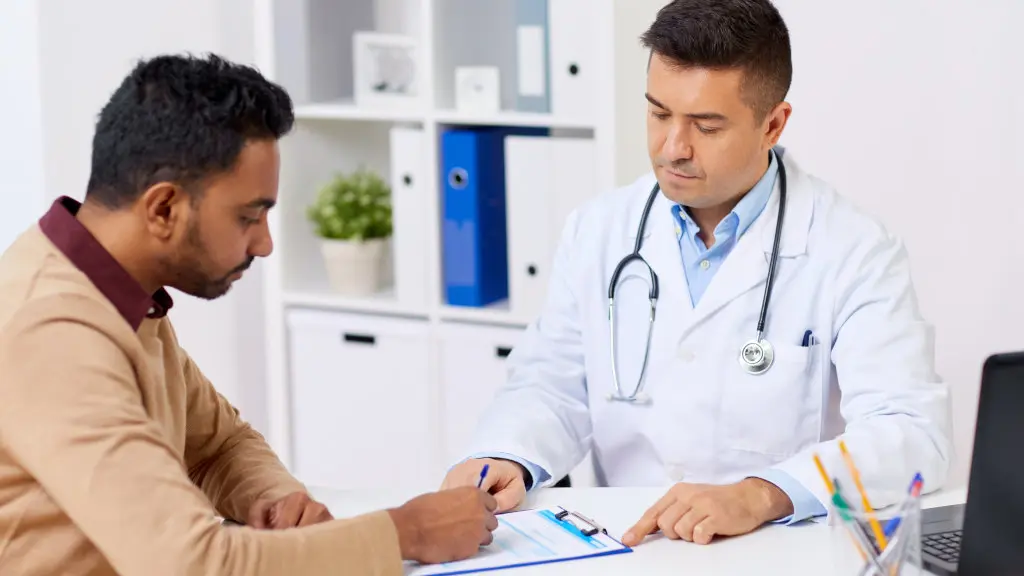 A doctor speaking with a patient at an alcohol withdrawal assessment