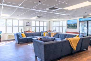 Arista Recovery Ohio recreation lounge with sectional seating and natural light