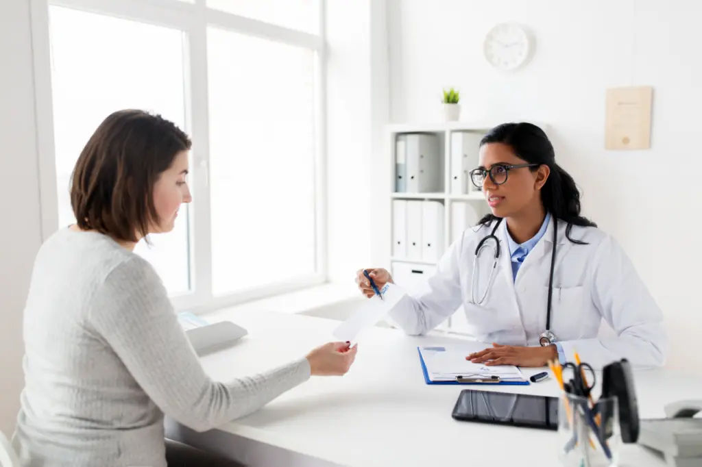 A doctor speaks with a patient. Learn more about benzodiazepine detox here.