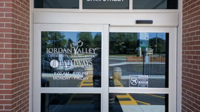 Exterior entrance showing 860 Lynn Street address on brick building with glass doors and facility signage