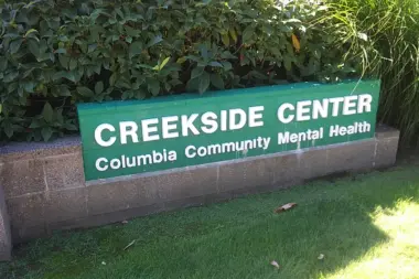 Close-up of exterior signage showing Creekside Center Columbia Community Mental Health
