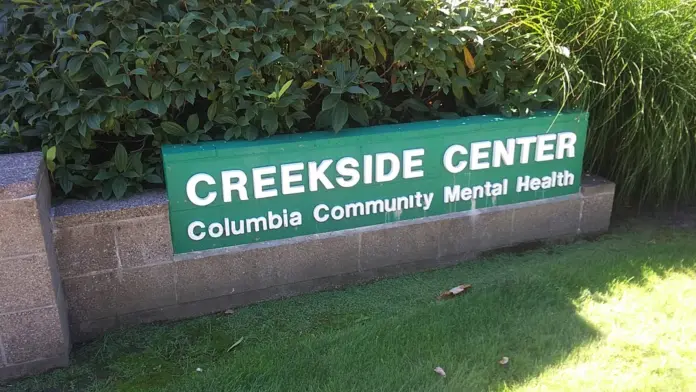 Close-up of exterior signage showing Creekside Center Columbia Community Mental Health