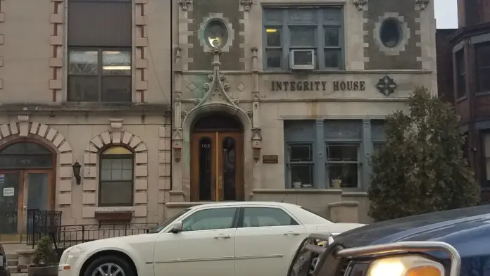 Exterior showing ornate stone facade with Gothic architectural features, decorative elements, and arched windows