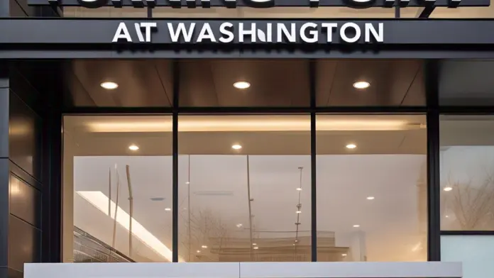 Front exterior showing illuminated Turning Point at Washington signage, glass storefront entry doors, and lit reception area interior visible through windows.
